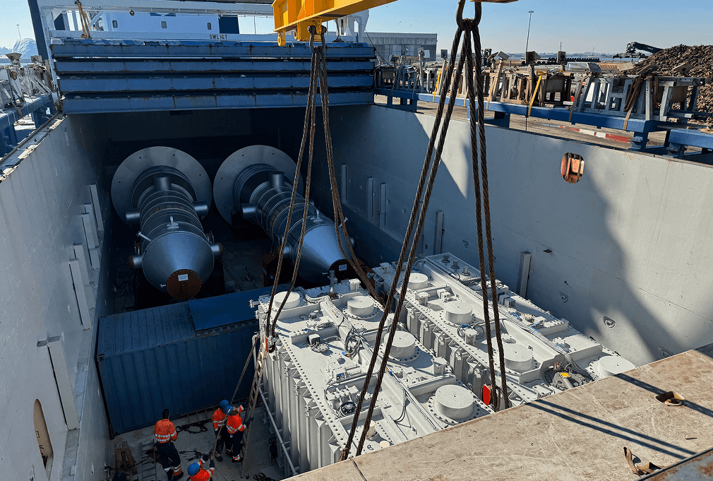 Two transformers stored with other heavy components
