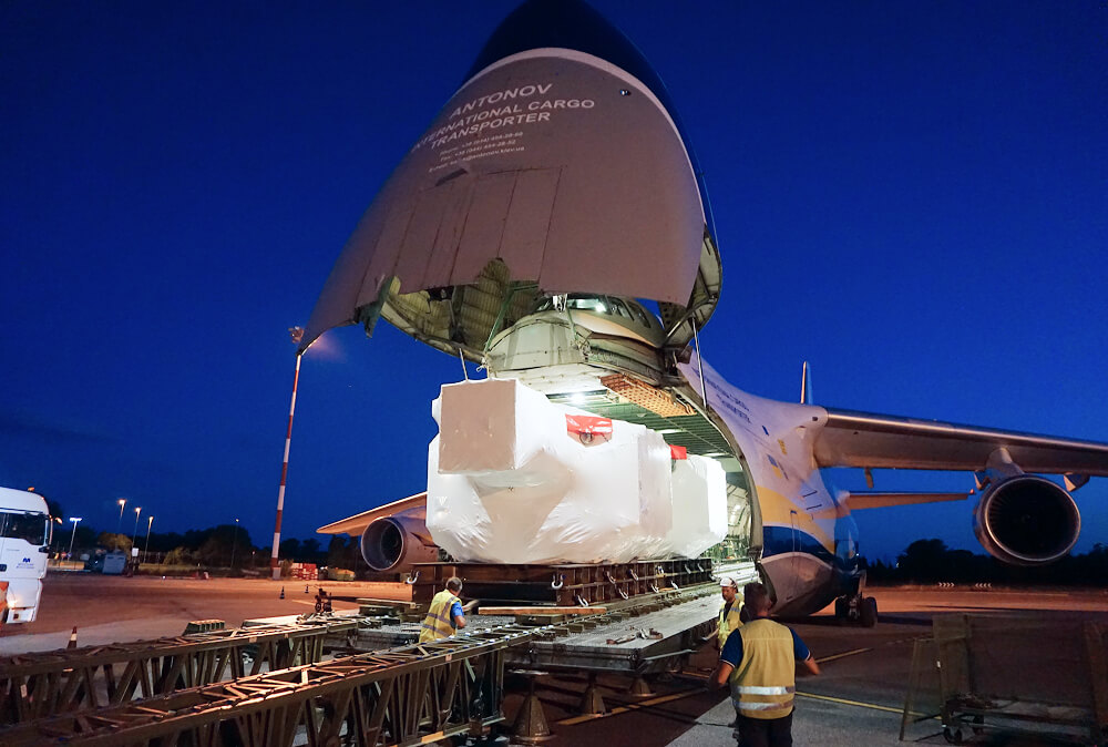 Heavy motors loaded on cargo aircraft at night
